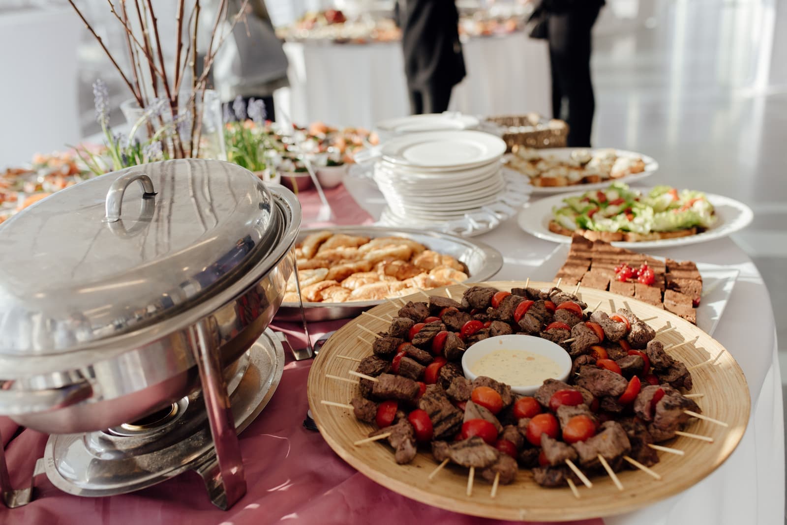 A buffet table set out with serving dishes