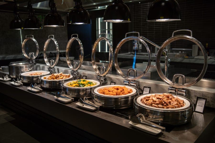 Stainless chafing dishes set up for service