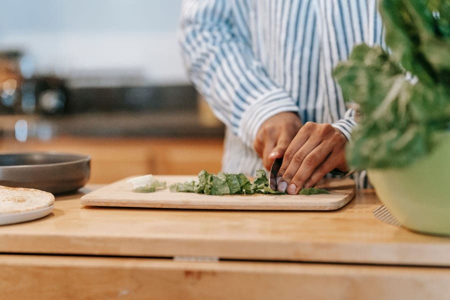 A thick wooden cutting board on a counter