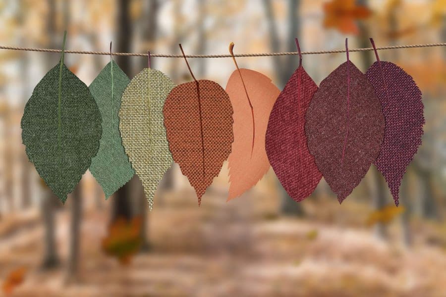 An autumn leaf garland draped along a surface