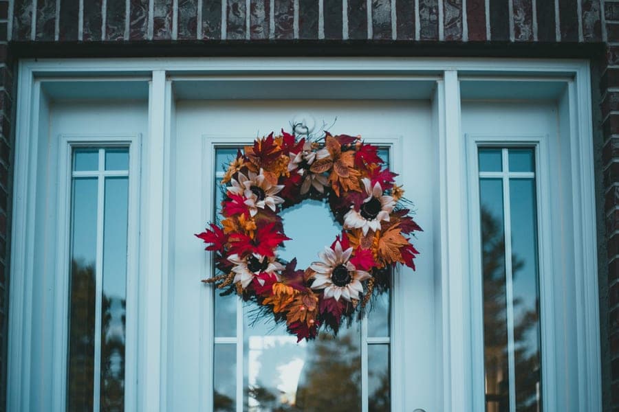 An autumn wreath hanging on a front door