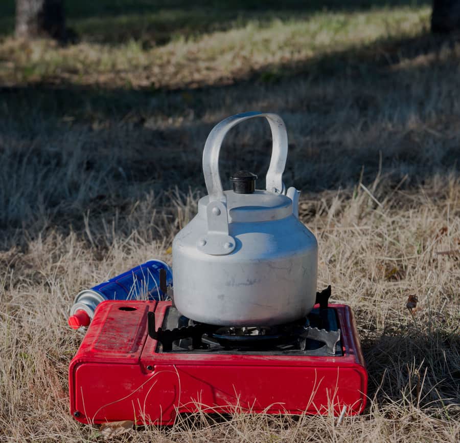 An outdoor propane burner stand ready for a large pot
