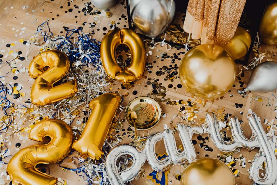 Gold balloons arranged against a wall